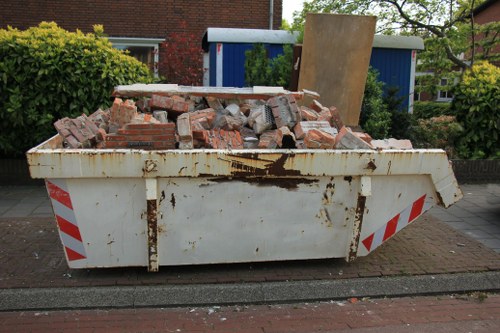 Rubbish collection vans operating in South London neighborhoods